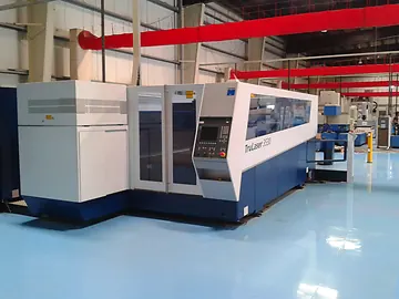 Industrial laser cutting machine on a factory floor